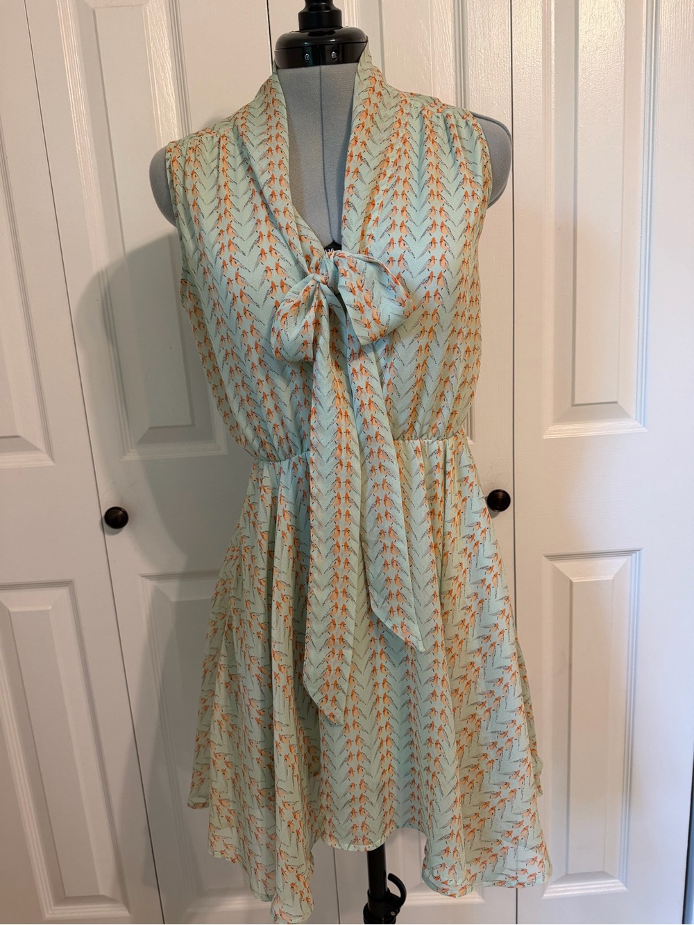 hazel Mint Sleeveless Tie-Neck Mini Dress with Orange Print
